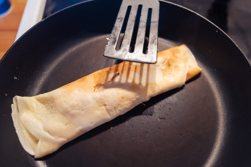 making norwegian pancakes with filling