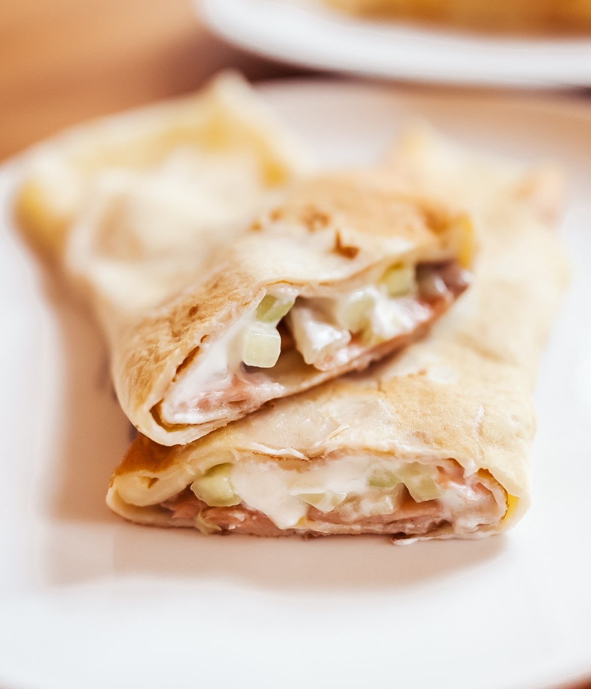 Norwegian pancakes with salmon and cucumber filling