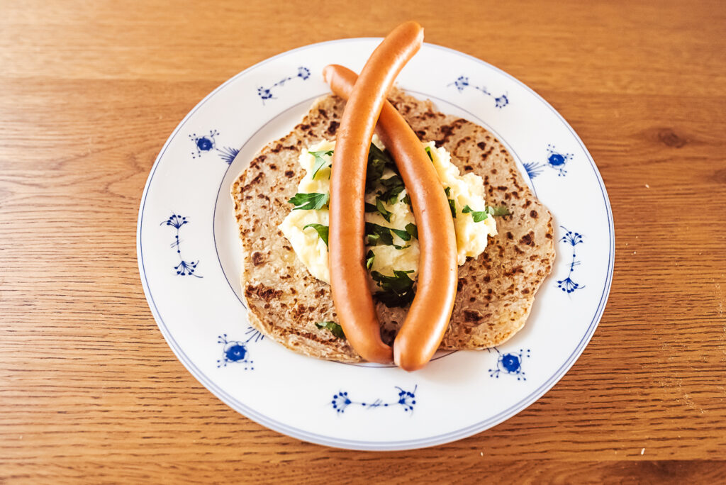 hotdogs on lomper with mashed potatoes