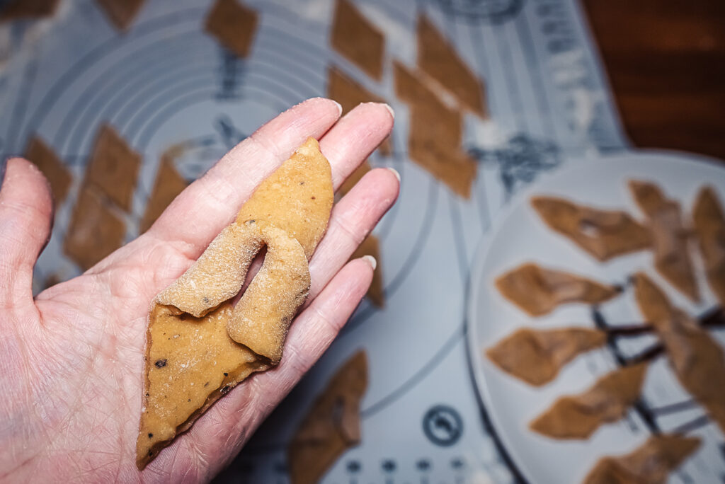 shaping Norwegian fattigmann Christmas cookies