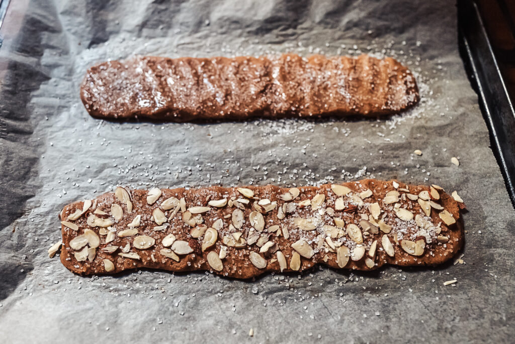 decorating brune pinner with pearl sugar and almonds