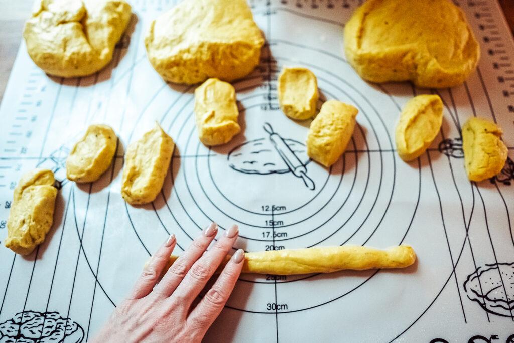 rolling lussekatter for st lucia buns