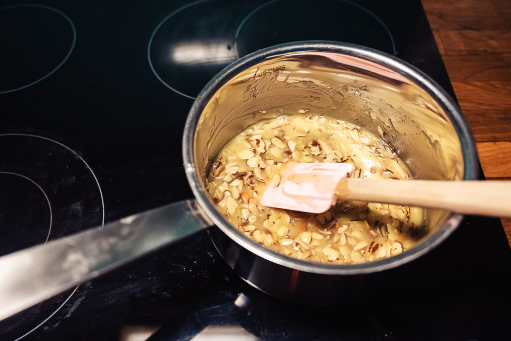 heating tosca cake topping in saucepan