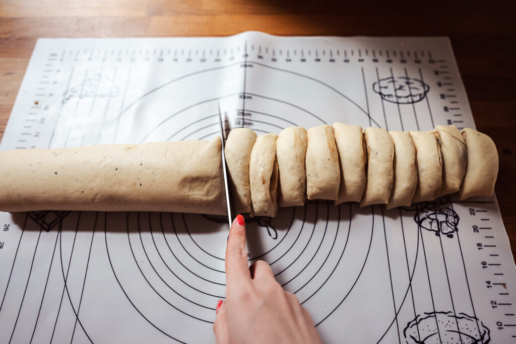 slicing Danish cinnamon rolls