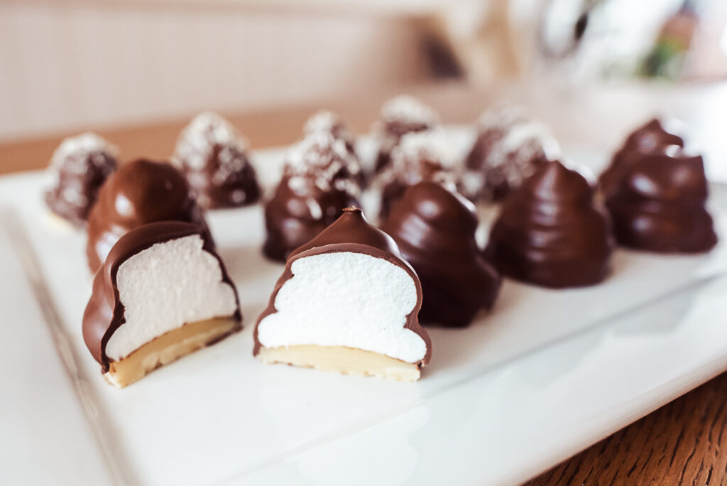 Danish flødeboller, marshmallow puffs with marzipan base