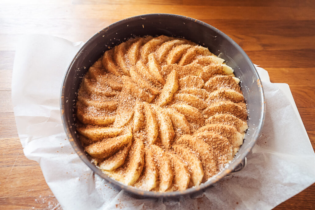 arranging apples on Norwegian apple cake