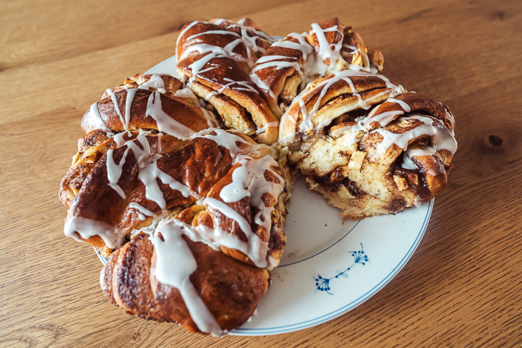 Norwegian apple kringle with one slice eaten