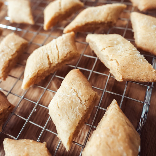 swedish butter cookies (kolasnittar) freshly cut and cooling on a wire rack