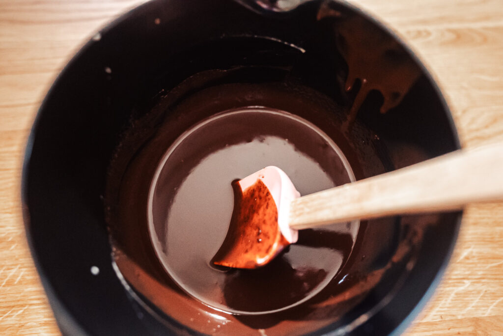 stirring melted chocolate and cream to make ganache