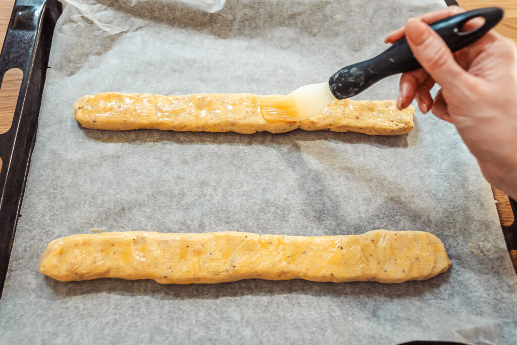brushing cookie dough with egg wash