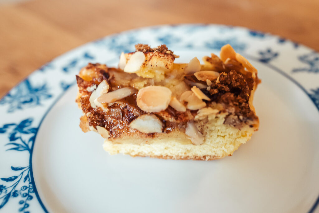 Norwegian apple almond cake slice on a plate