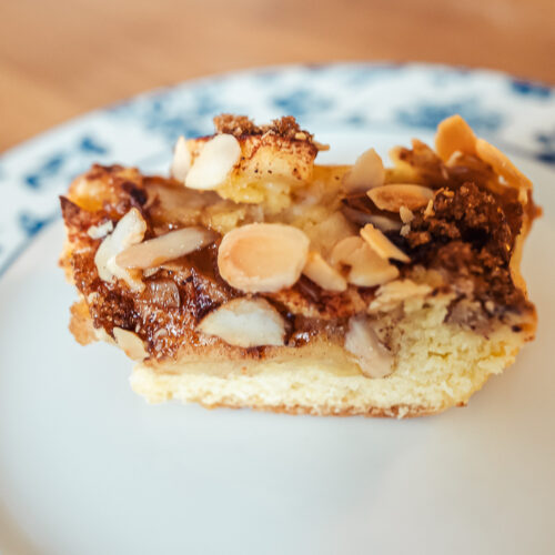 Norwegian apple almond cake slice on a plate