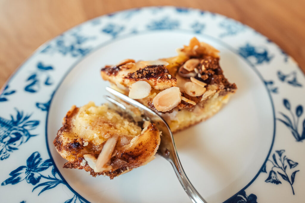 Norwegian apple almond cake slice on a blue plate