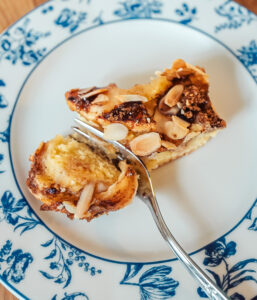 Norwegian apple almond cake slice on a blue plate