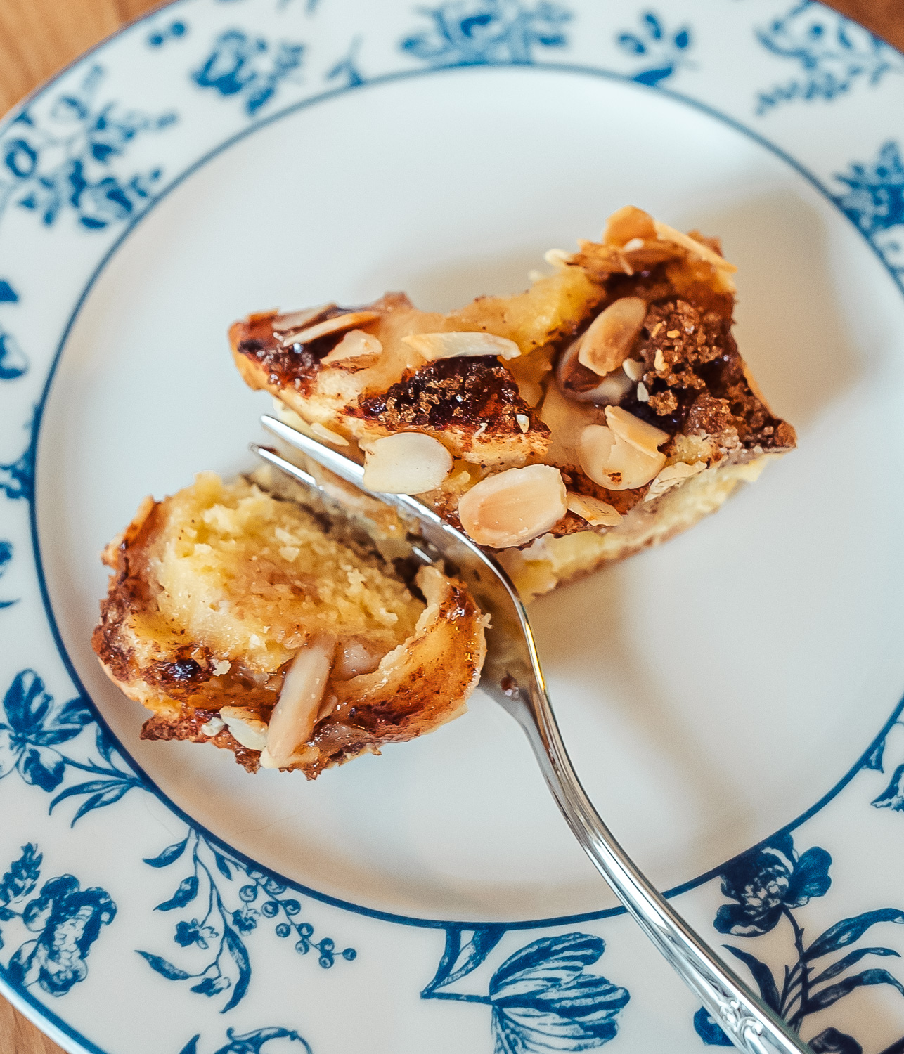 Norwegian apple almond cake slice on a blue plate