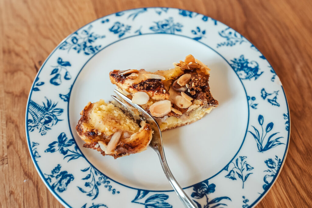 Norwegian apple almond cake slice on a blue plate