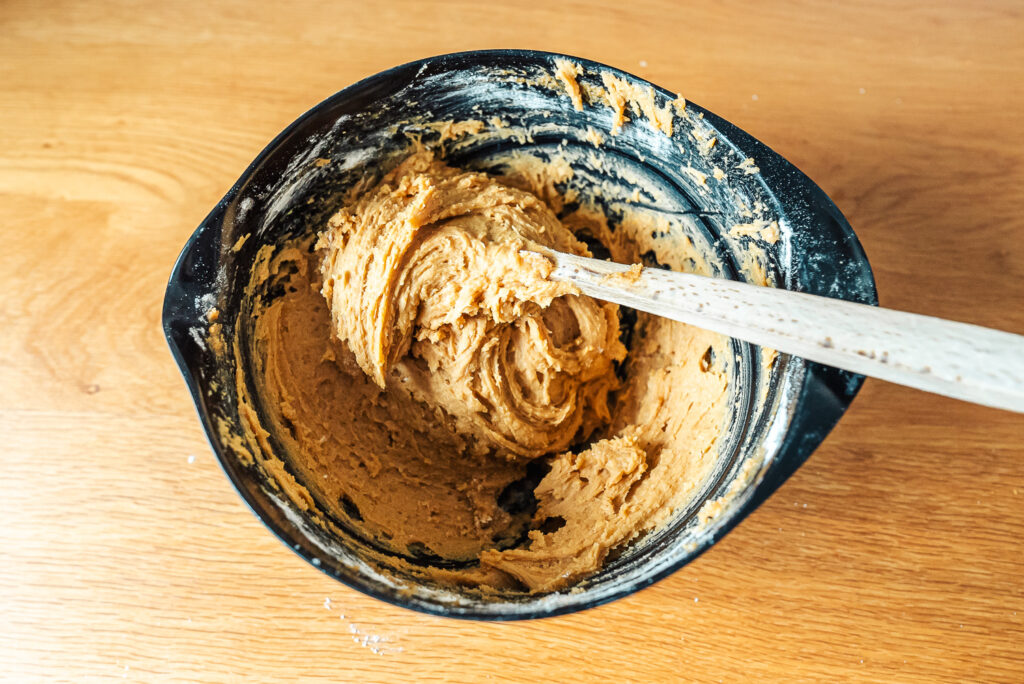 mixing Norwegian brown cheese cookie dough in a bowl
