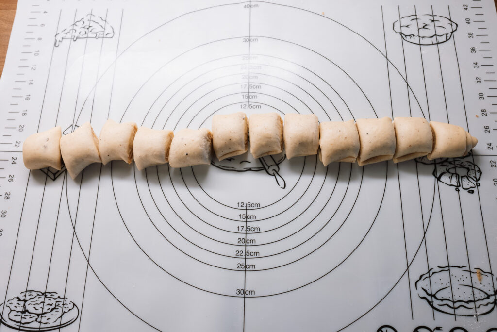 slicing Swedish gifflar (mini cinnamon rolls)