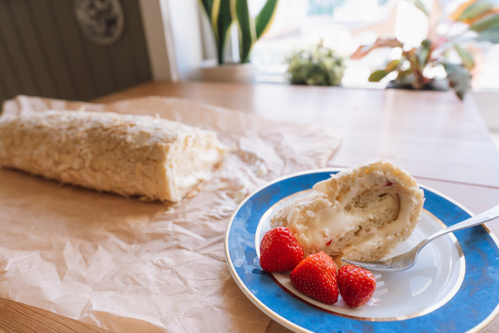Norwegian budapestkake, rolled verdens beste (kvæfjordkake) on a plate